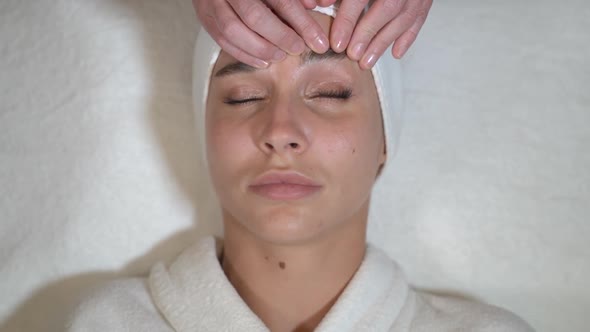 Woman's Eyebrows Are Massaged
