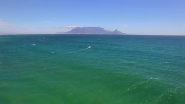 Travel drone Table Mountain, Table Bay, kiteboarders, Bloubergstrand, Cape Town, South Africa. alt