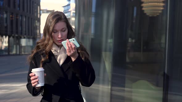 Stylish Business Woman Sending Audio Voice Message On Cellphone At Outdoor