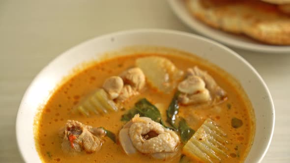 Chicken curry soup with roti or naan with chicken tikka masala - Asian food style alt