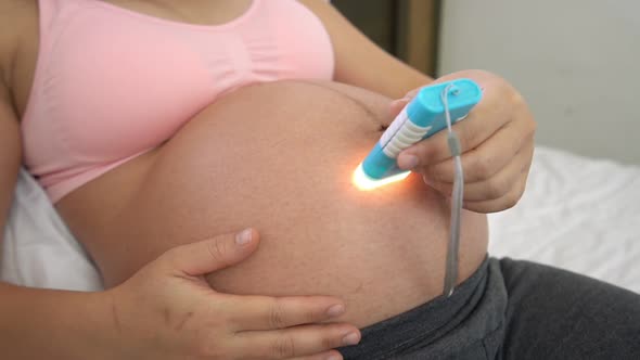 Happy Pregnant Woman and Expecting Baby at Home alt