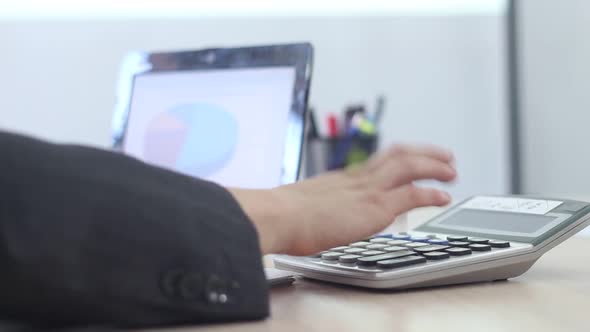 Man Working In The Office Using Laptop