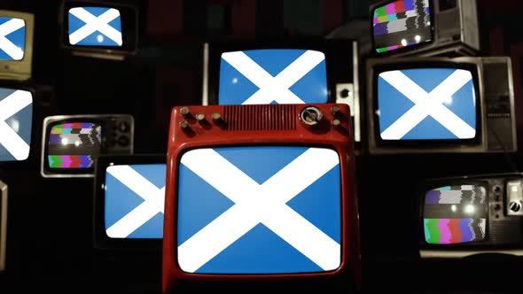 Scotland Flags and Stack of Ancient TVs. alt