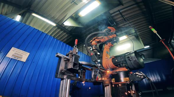 Automated Mechanism Is Welding a Metal Carcass alt