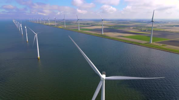 Wind Turbines in the Early Morning Wind Mill Park in the Netherlands alt