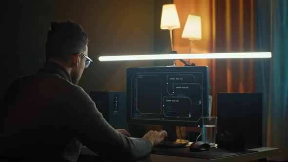 Young Man Mobile Developer Writes Program Code on a Computer Programmer Work in Home Office alt