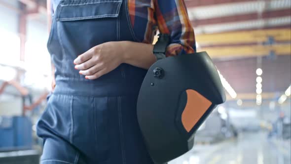 Smiling Female Factory Laborer Going to Work alt