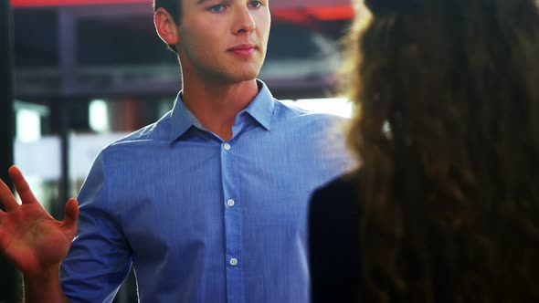 Business executives discussing during meeting alt