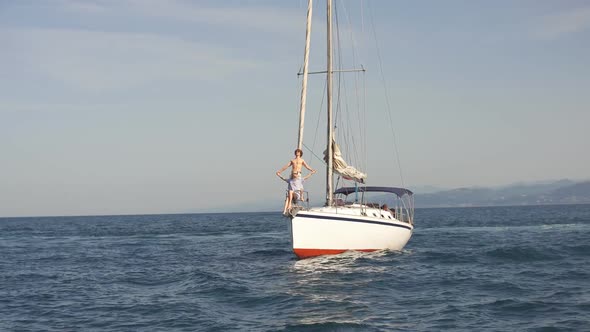 Amazing Seascape with White Sailing Boat in Blue Sea. alt