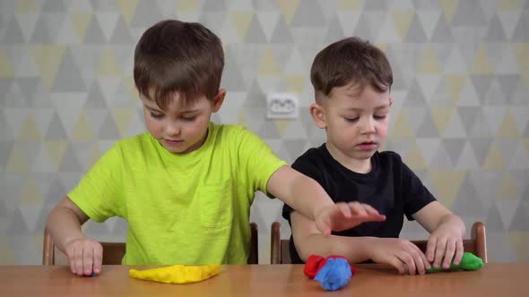 Little Children Girl and Boy Molding From Play Dough