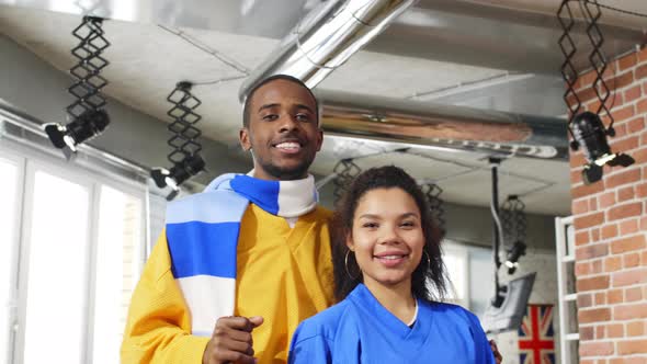 Joyful couple in fan clothes