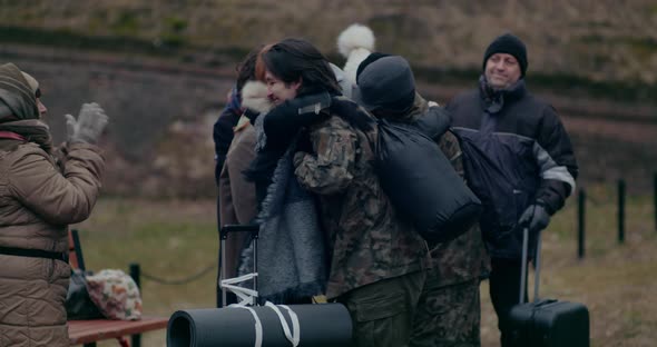 Happy Refugees Clapping And Welcoming Military Soldiers alt