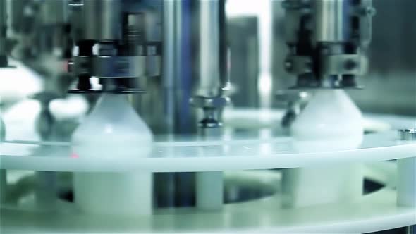 Medicine Bottles at the Robotized Production Line of a Pharmaceutical Plant. 4K Version. alt