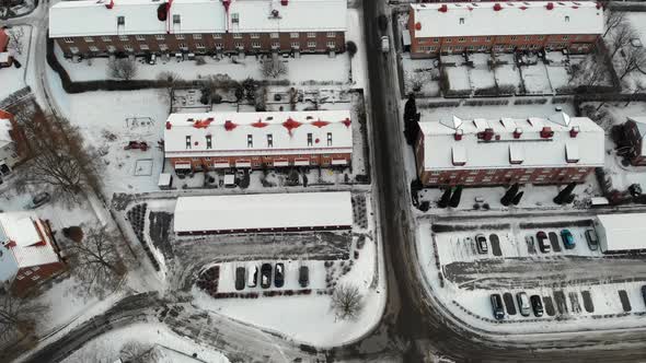 Snowy Rooftops Long Buildings in Industrial Community Aerial Top alt