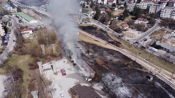 Aerial View Of Firemen Calming The Fire In A Building 4K