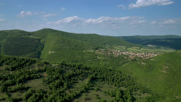 The picturesque spring valley between hills of Eastern Balkan Mountains. alt