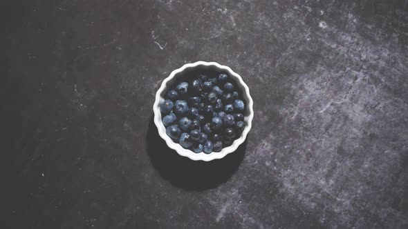Fresh Organic Blueberry in Mini Bowl on Vintage Dark Table