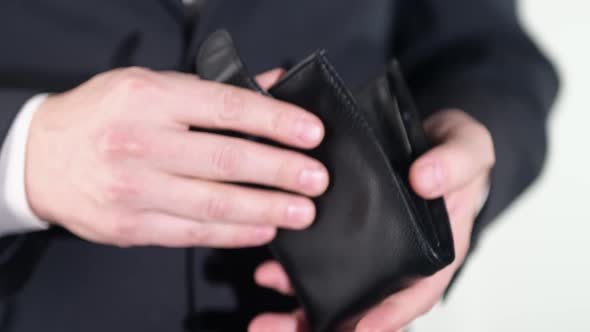 Close-up of a man's hand holding a leather wallet. close up. HD