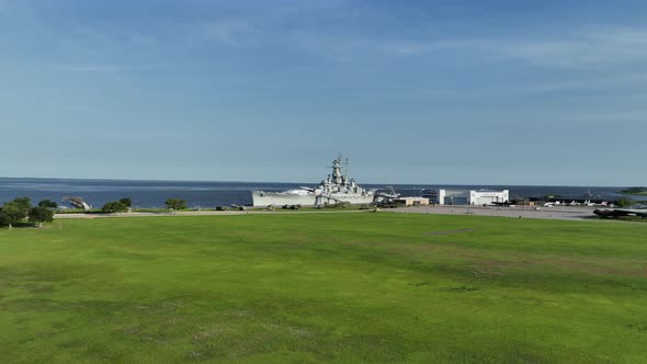 Aerial approach towards the USS Alabama Battleship alt