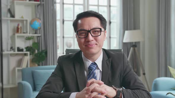 Asian Businessman Talking On The Video Call While Working At Home alt