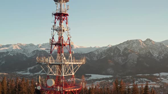 Zakopane-Gubalowka Transmitter Tower With Snowy Mountain  In Background At Zakopane, Poland. - aeria alt