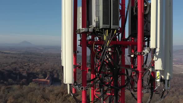 Tilting on telecommunication tower equipment aerial 4K footage alt