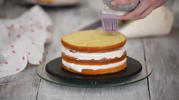 Soaking Sponge Cake Layer with Sugar Syrup