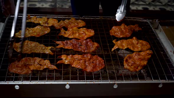 Making of Delicious Slice of Dried and Grilled Fish in Sweet Sauce on Street Food Stalls in Thailand alt