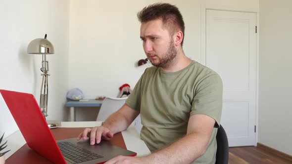 Man Works on Laptop Executes an Order Enters a Message Thinks About an Order alt