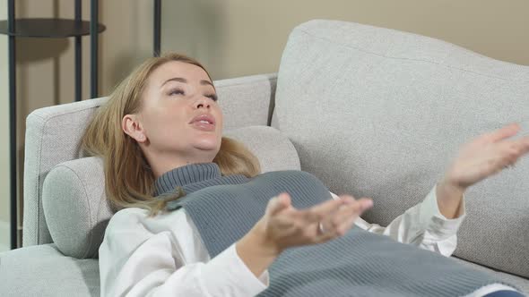 Woman Lying on Couch at Psychologist Office Female Doctor Taking Notes