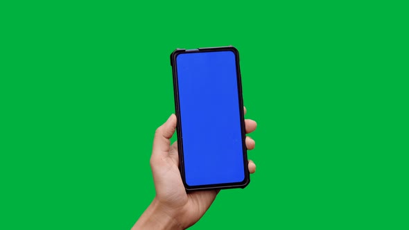 Woman hand holding and touching screen the smartphone with blue screen