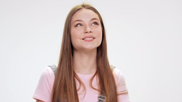 Dreamy Young Beautiful Girl Smiling Over White Background alt