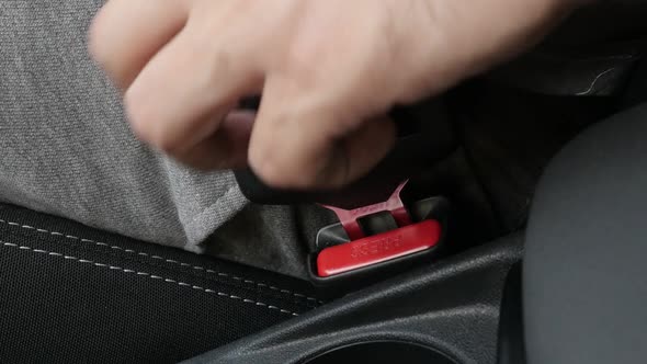 Unlocking passenger 3-point seat  belt slow-mo video