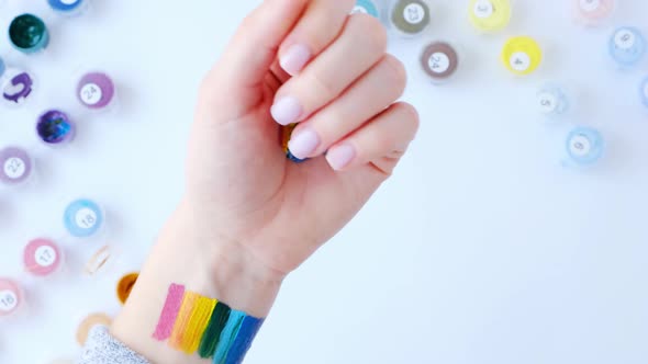 Rainbow LGBTQ Flag Painted on Hand alt