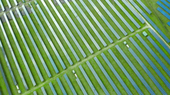 Flight Over a Solar Power Station for Production of Electricity. Vertical Straight Lines of Solar alt