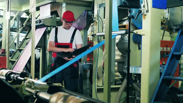 Engineer Is Observing Production Process of Plastic Materials alt