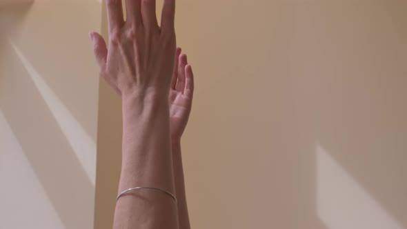 Gymnastics Yoga. Hands Are Reduced To the Lock Above the Head in the Form of a Pistol alt