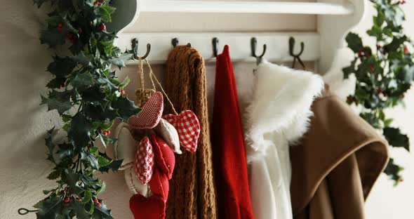 Christmas decoration with clothes hanging on hanger alt