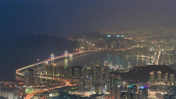 The Gwangandaegyo or Diamond Bridge from day to night as seen from the hill alt