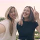 Young woman friends taking selfie self-portrait photos on smartphones. - VideoHive Item for Sale
