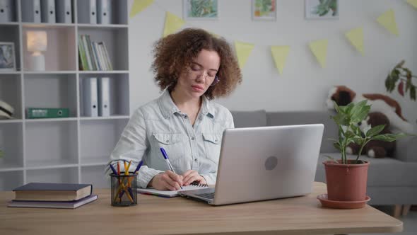 Distance Education Young Female Student is Undergoing Training Online Using Modern Technologies alt