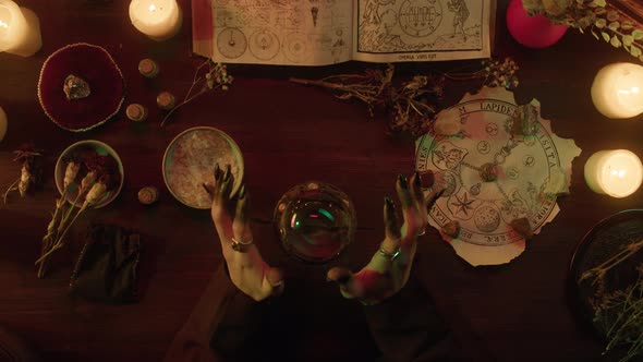 Witch Using Magic Crystal Ball Top View alt