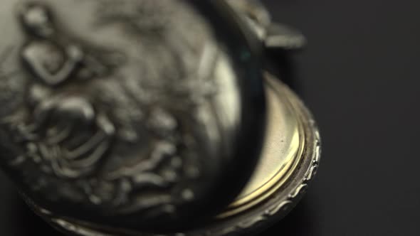 Engraving on a Vintage Clock Close Up alt