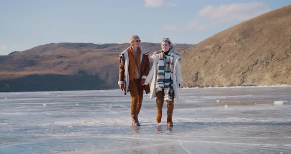 The girl with the bionic prosthesis is walking along a frozen Baikal lake Bionics Cybernetic alt