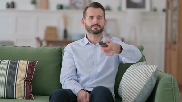 Excited Young Man Reacting to Win on Television alt