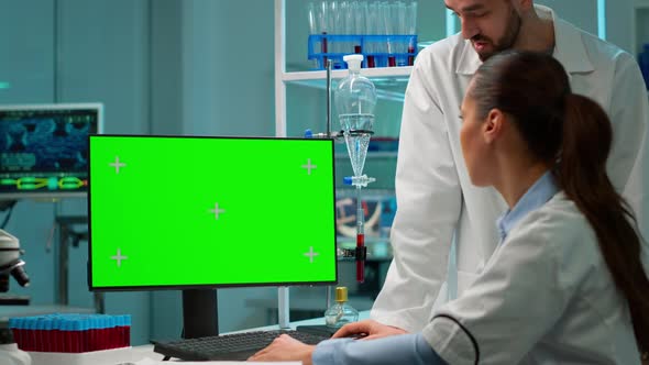 Research Scientists Using Desktop Computer with Mock Up Template alt