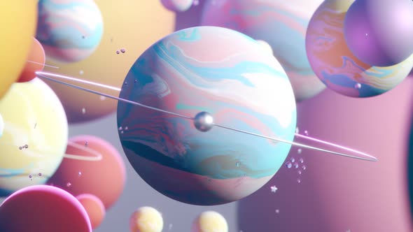 Endless looping animation with bright, colorful planets and shiny spinning moons alt