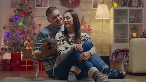 Young Man Surprising His Girlfriend on Christmas Day alt