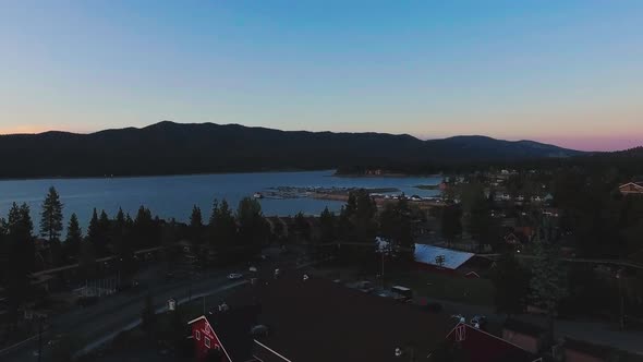 Drone moves over the roofs near Big Bear observatory, Big Bear Lake, California alt