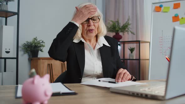 Senior Business Woman Analysing Paperwork Documents Loses Bad Fortune Loss Deadline Problem alt